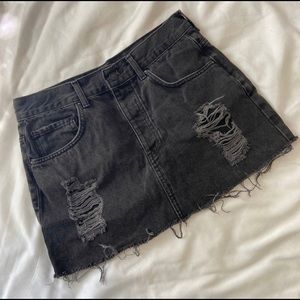 Mini black ripped jeans skirt